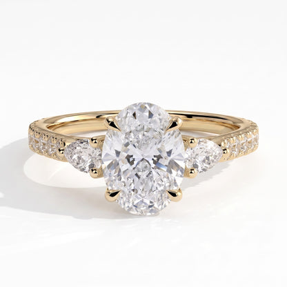 Oval lab-grown diamond three-stone engagement ring in 14K (585) yellow gold, front view 