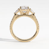 Oval lab-grown diamond three-stone engagement ring in 14K (585) yellow gold, side profile 