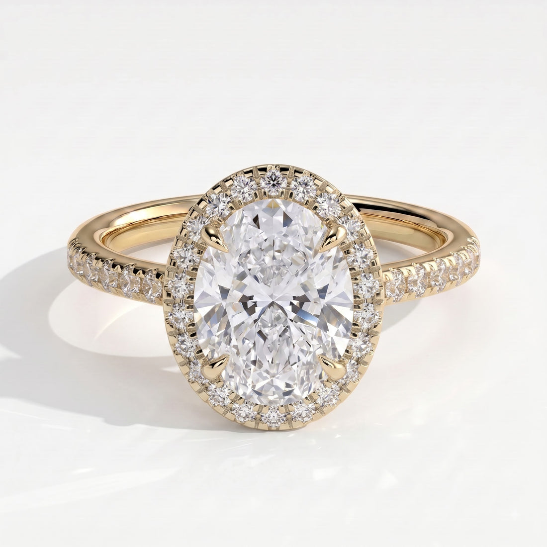Oval lab-grown diamond halo engagement ring in 14K (585) yellow gold, front view 