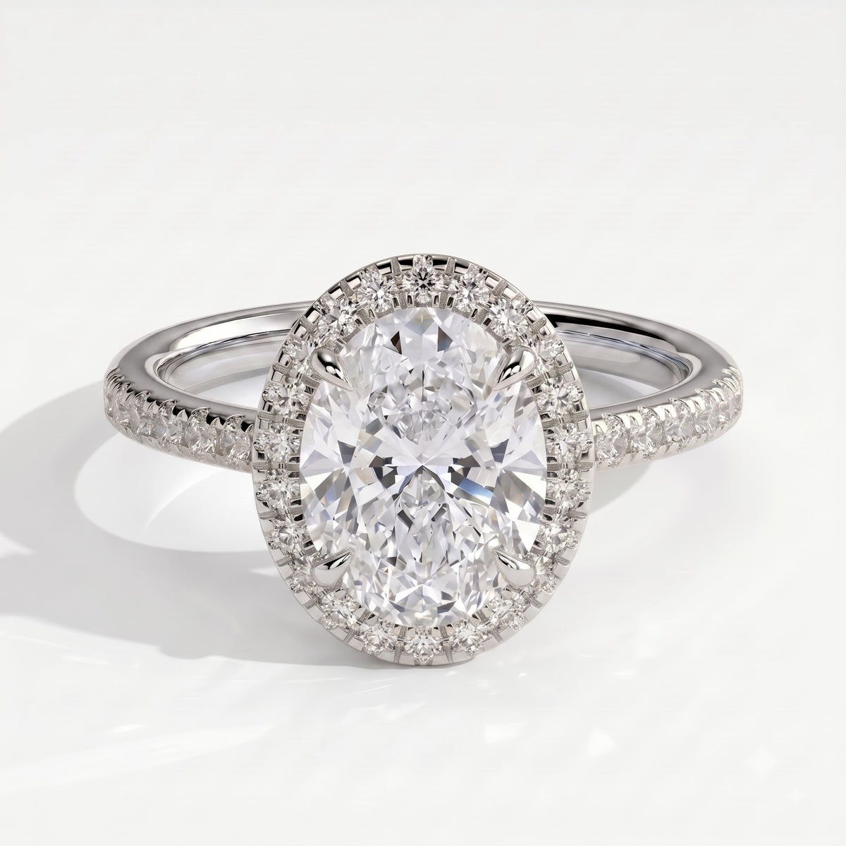 Oval lab-grown diamond halo engagement ring in 14K (585) white gold, front view 