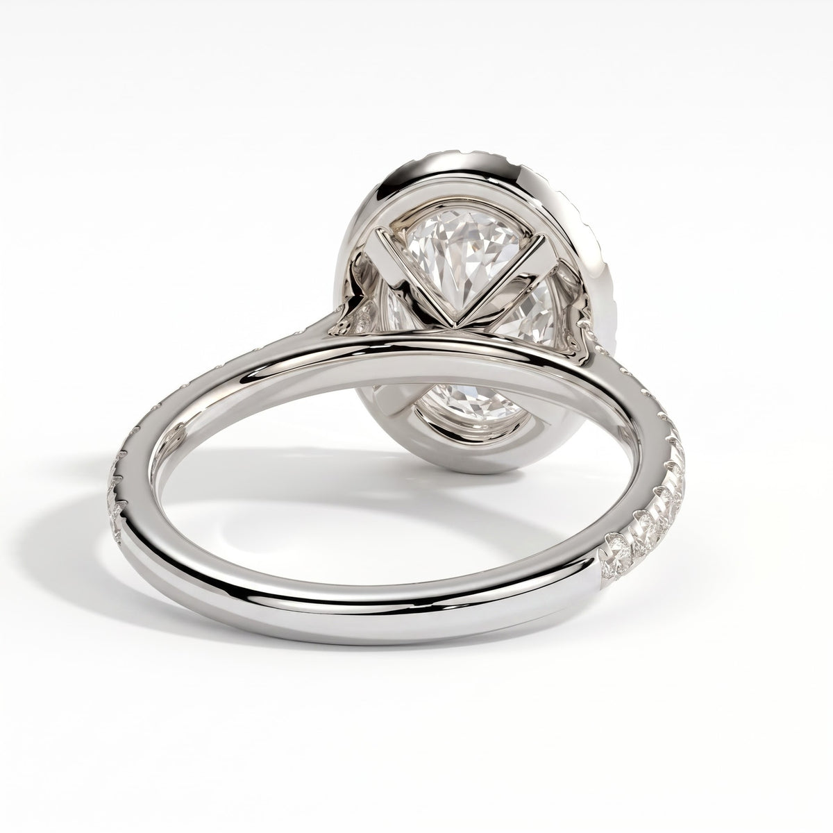 Oval lab-grown diamond halo engagement ring in 14K (585) white gold, on white background 