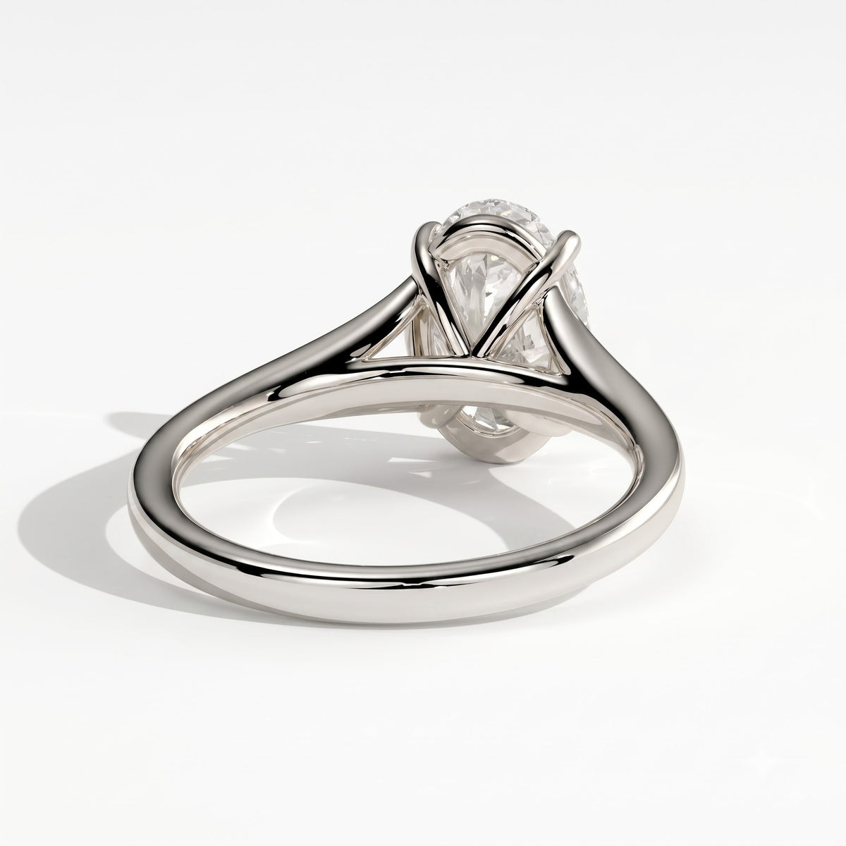 Oval lab-grown diamond solitaire engagement ring in 18K (750) white gold, on white background 