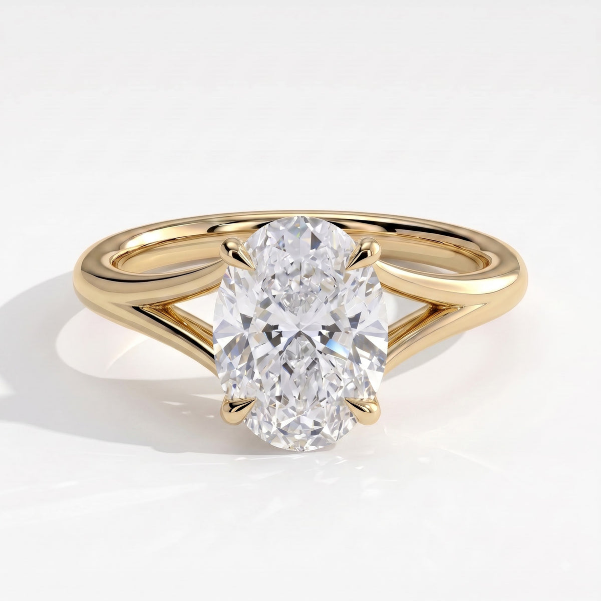 Oval lab-grown diamond solitaire engagement ring in 18K (750) yellow gold, front view 