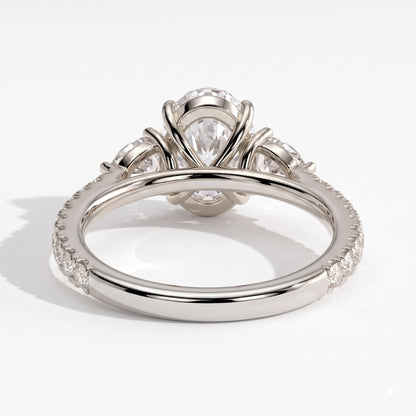 Oval lab-grown diamond three-stone engagement ring in 18K (750) white gold, on white background 