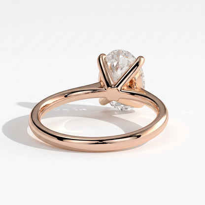 Oval lab-grown diamond solitaire engagement ring in 18K (750) rose gold, on white background 