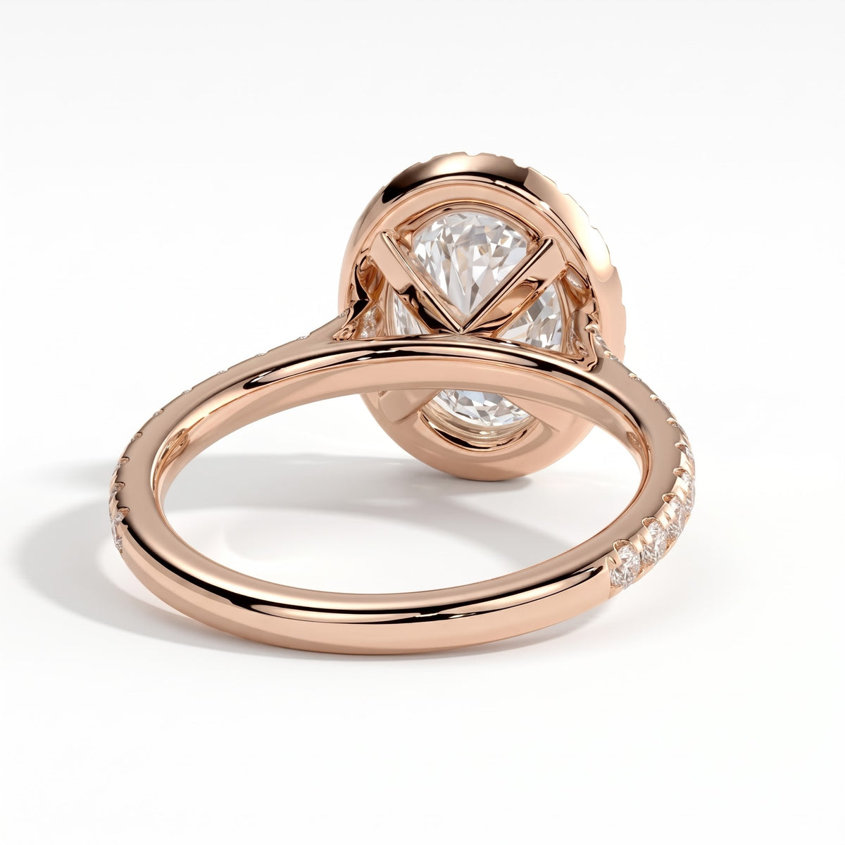 Oval lab-grown diamond halo engagement ring in 18K (750) rose gold, on white background 