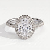 Oval lab-grown diamond halo engagement ring in 18K (750) white gold, front view 