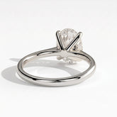 Oval lab-grown diamond solitaire engagement ring in 950 platinum, on white background 