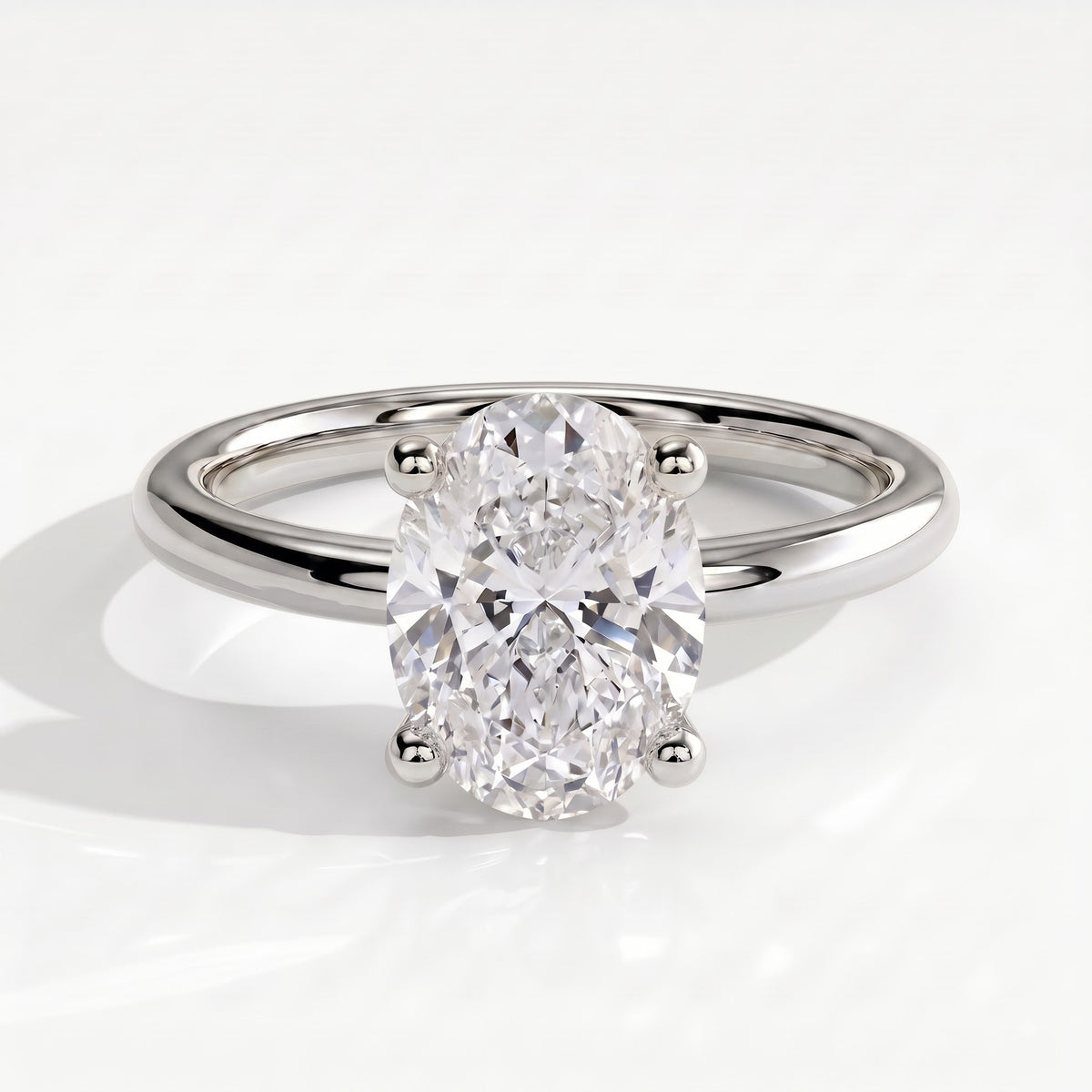 Oval lab-grown diamond solitaire engagement ring in 950 platinum, front view 