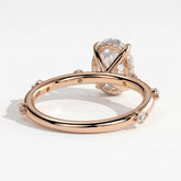 Oval lab-grown diamond halo engagement ring in 14K (585) rose gold, on white background 