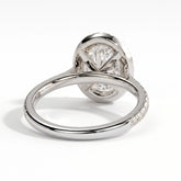 Oval lab-grown diamond halo engagement ring in 950 platinum, on white background 
