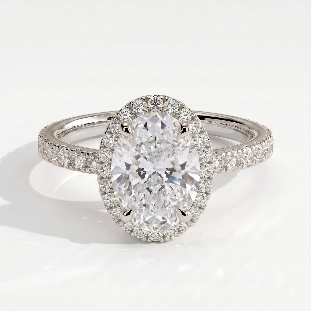 Oval lab-grown diamond halo engagement ring in 14K (585) white gold, front view 