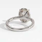 Oval lab-grown diamond halo engagement ring in 14K (585) white gold, on white background 