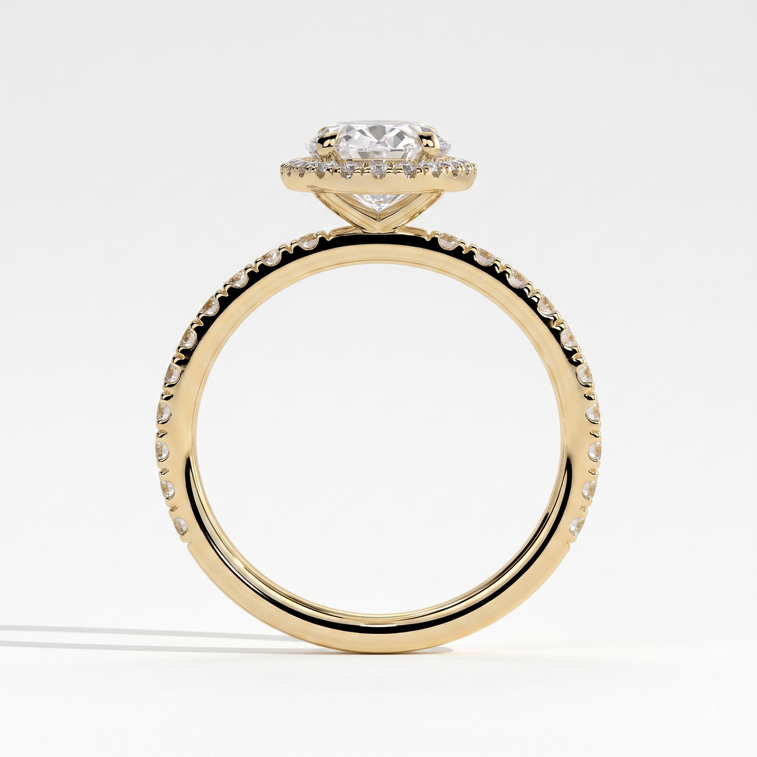 Oval lab-grown diamond halo engagement ring in 14K (585) yellow gold, side profile 