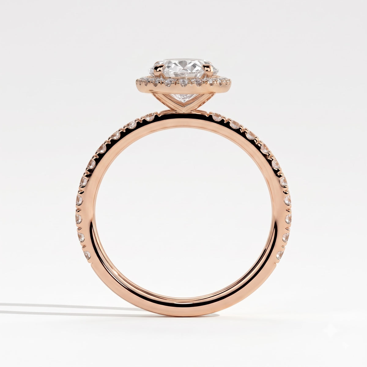Oval lab-grown diamond halo engagement ring in 18K (750) rose gold, side profile 