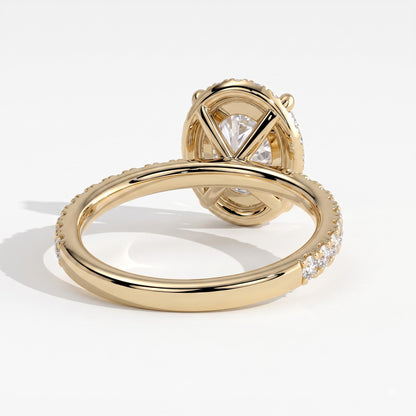 Oval lab-grown diamond halo engagement ring in 18K (750) yellow gold, on white background 