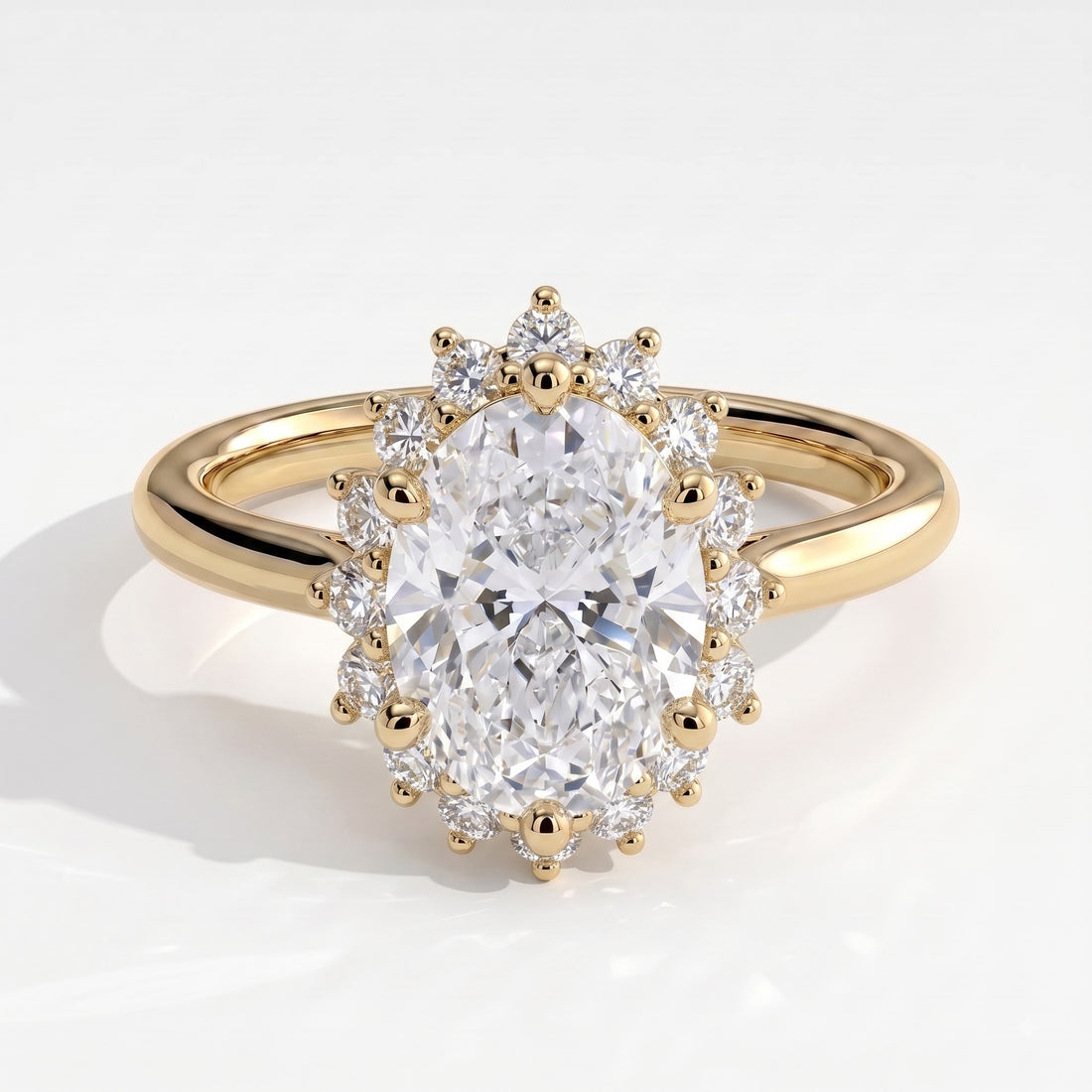 Oval lab-grown diamond halo engagement ring in 14K (585) yellow gold, front view 