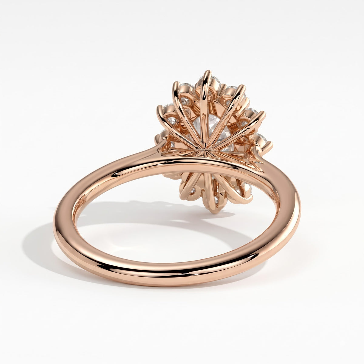 Oval lab-grown diamond halo engagement ring in 14K (585) rose gold, on white background 
