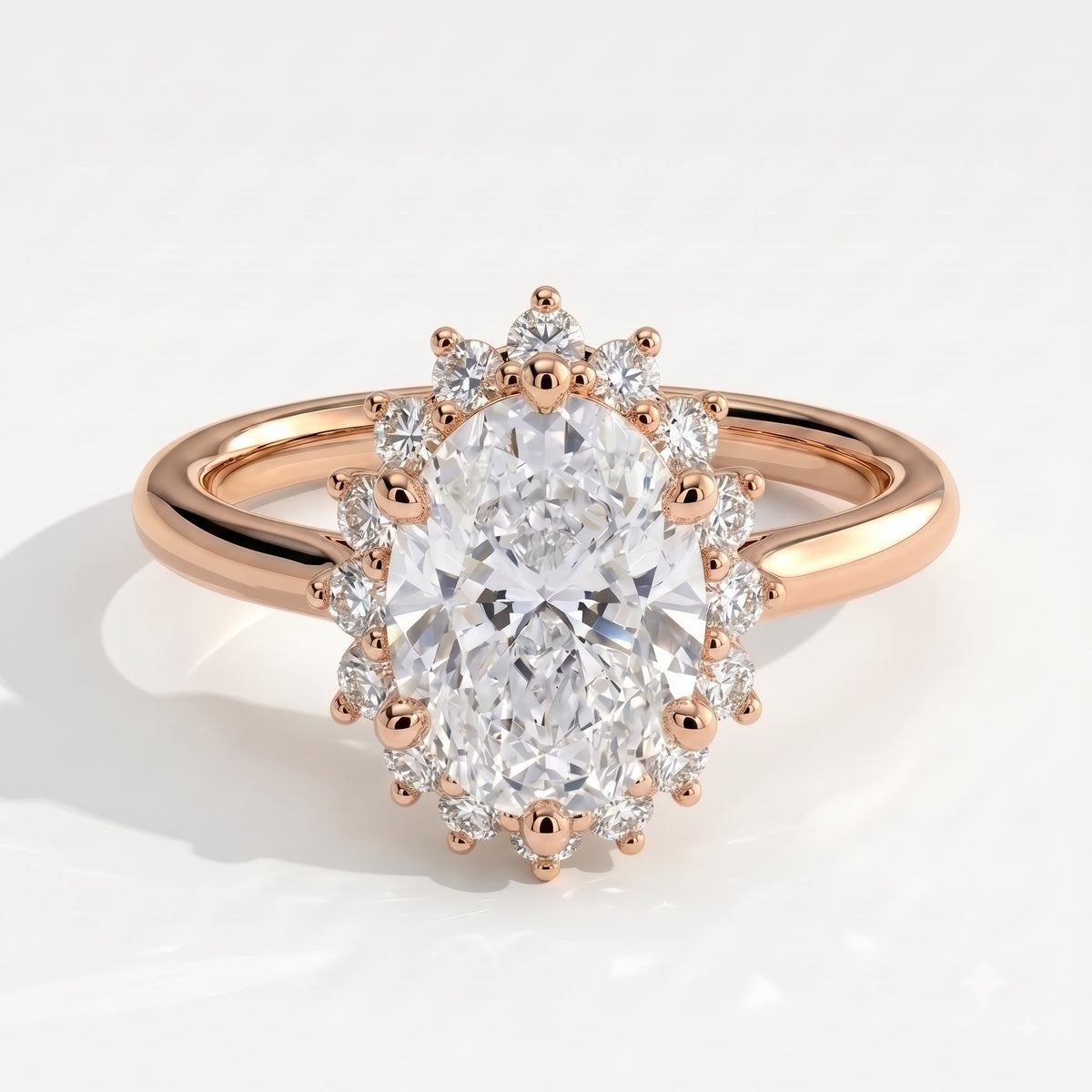 Oval lab-grown diamond halo engagement ring in 14K (585) rose gold, front view 
