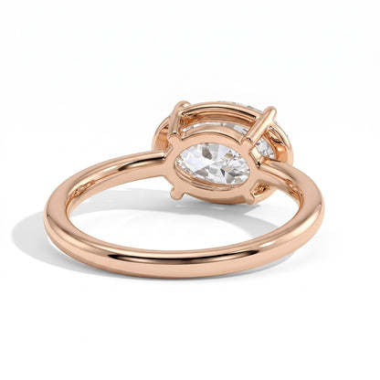 Oval lab-grown diamond bezel-set east-west solitaire engagement ring in 14K (585) rose gold, on white background 