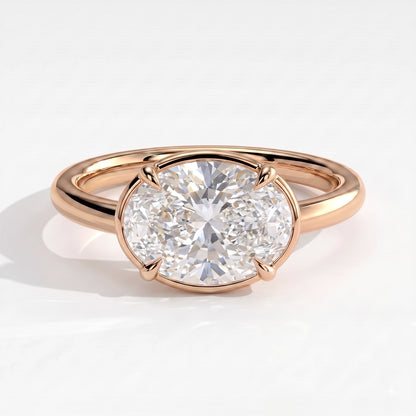 Oval lab-grown diamond bezel-set east-west solitaire engagement ring in 14K (585) rose gold, front view 