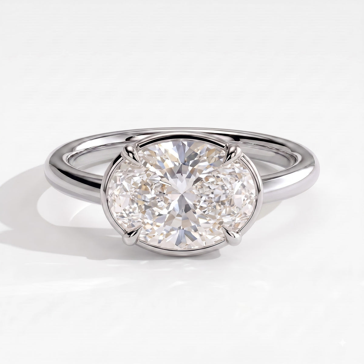 Oval lab-grown diamond bezel-set east-west solitaire engagement ring in 14K (585) white gold, front view 