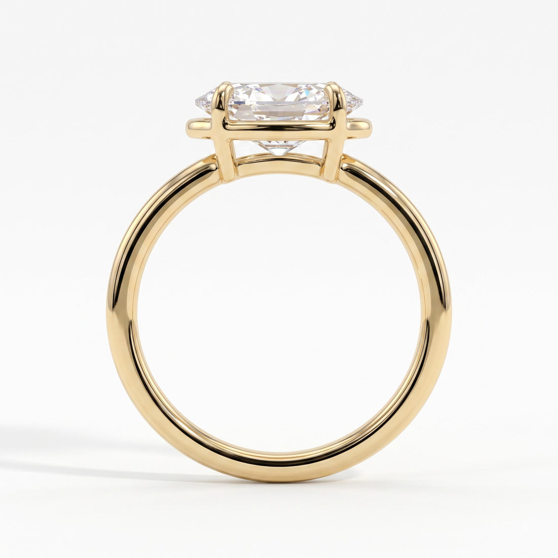 Oval lab-grown diamond bezel-set east-west solitaire engagement ring in 14K (585) yellow gold, side profile 