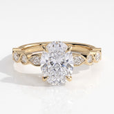 Oval lab-grown diamond bezel-set halo engagement ring in 14K (585) yellow gold, front view 