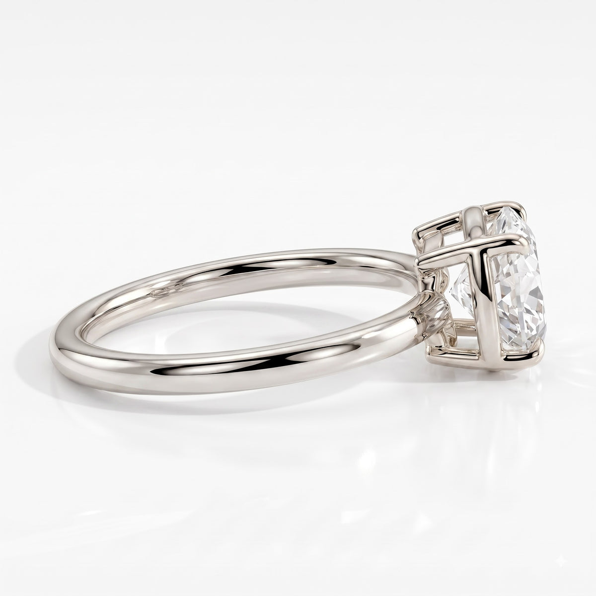 Oval lab-grown diamond bezel-set east-west solitaire engagement ring in 18K (750) white gold, detail view 