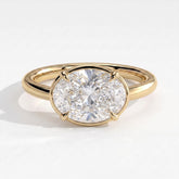 Oval lab-grown diamond bezel-set east-west solitaire engagement ring in 18K (750) yellow gold, front view 