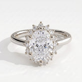 Oval lab-grown diamond halo engagement ring in 18K (750) white gold, front view 