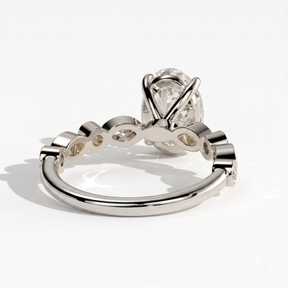 Oval lab-grown diamond bezel-set halo engagement ring in 18K (750) white gold, on white background 