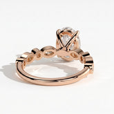 Oval lab-grown diamond bezel-set halo engagement ring in 18K (750) rose gold, on white background 