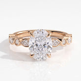 Oval lab-grown diamond bezel-set halo engagement ring in 18K (750) rose gold, front view 