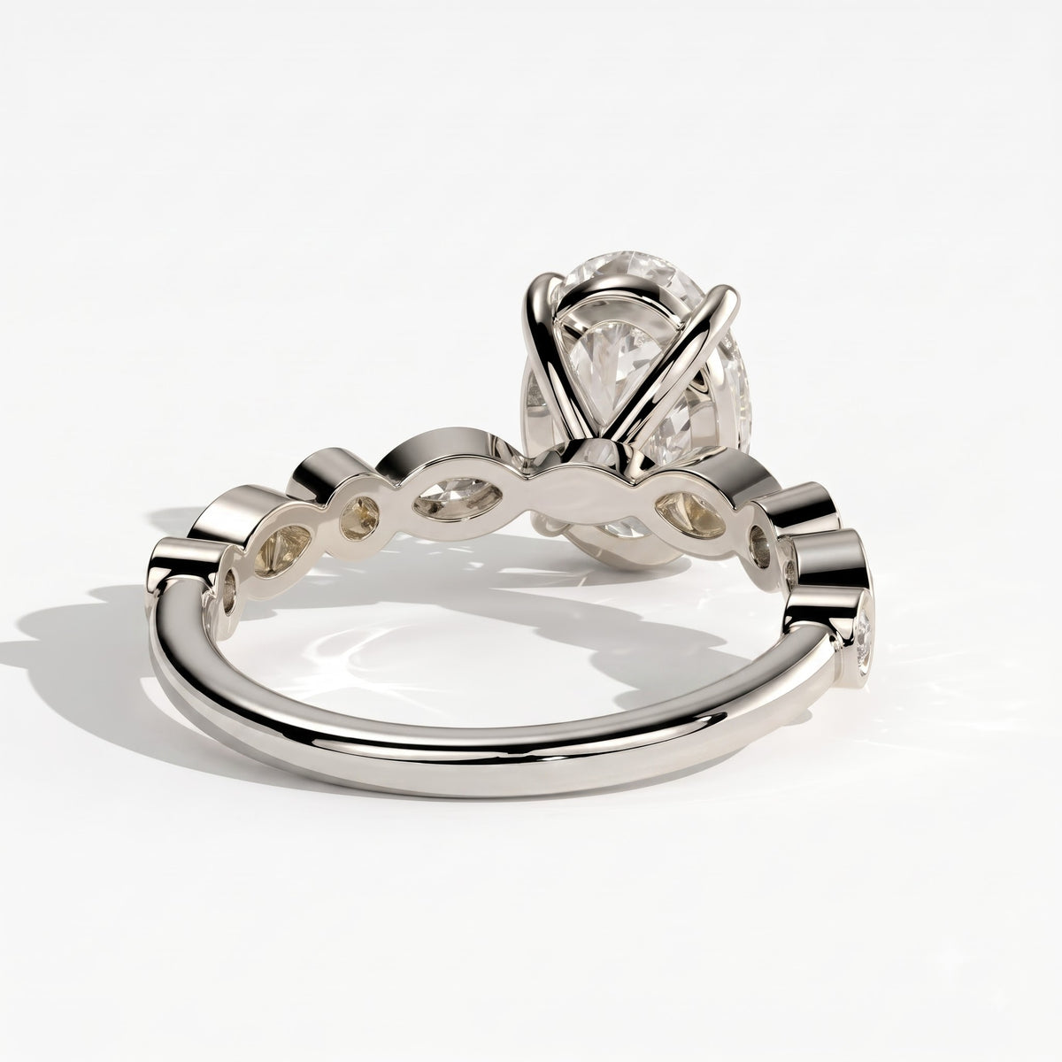 Oval lab-grown diamond bezel-set halo engagement ring in 950 platinum, detail view 