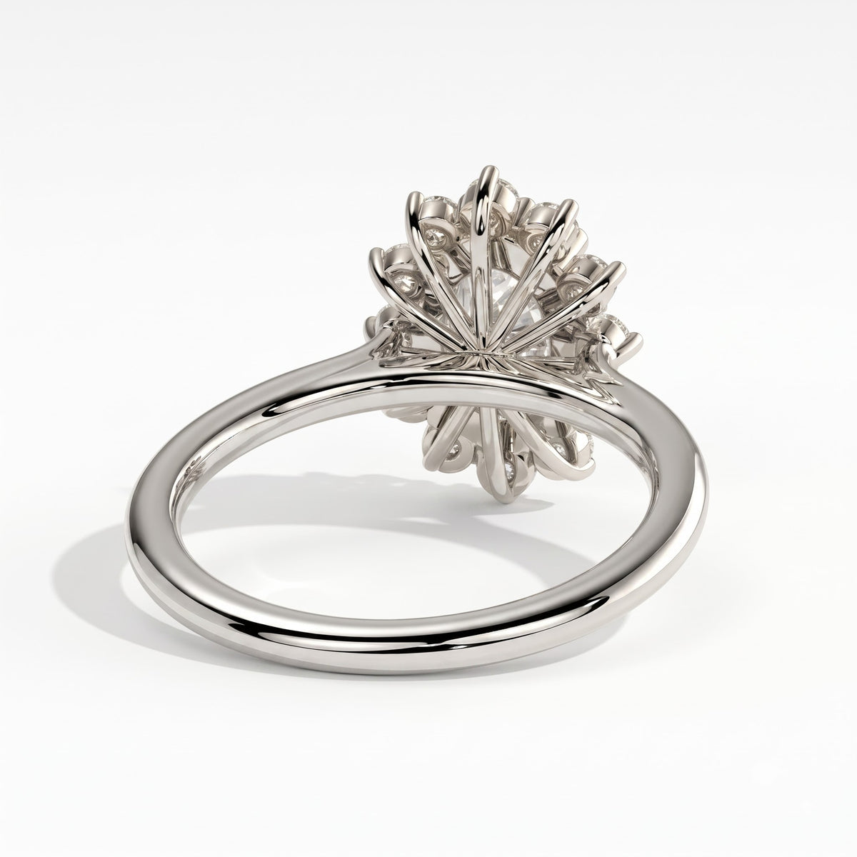 Oval lab-grown diamond halo engagement ring in 950 platinum, on white background 
