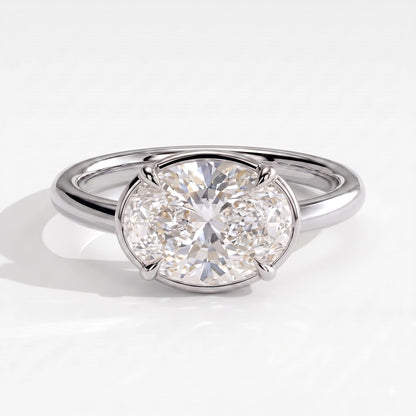 Oval lab-grown diamond bezel-set east-west solitaire engagement ring in 950 platinum, front view 