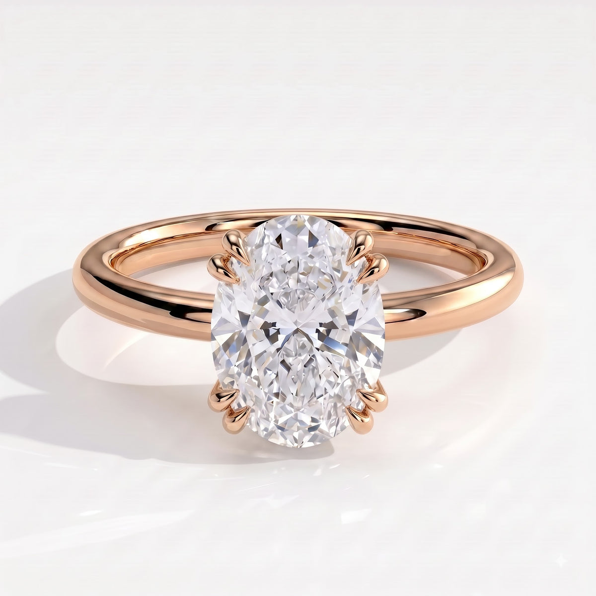 Oval lab-grown diamond halo engagement ring in 14K (585) rose gold, front view 