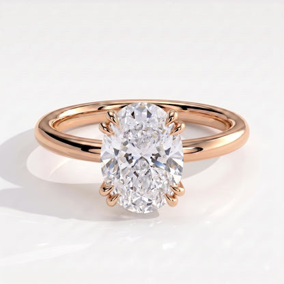 Oval lab-grown diamond halo engagement ring in 14K (585) rose gold, front view 