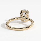 Oval lab-grown diamond halo engagement ring in 14K (585) yellow gold, on white background 