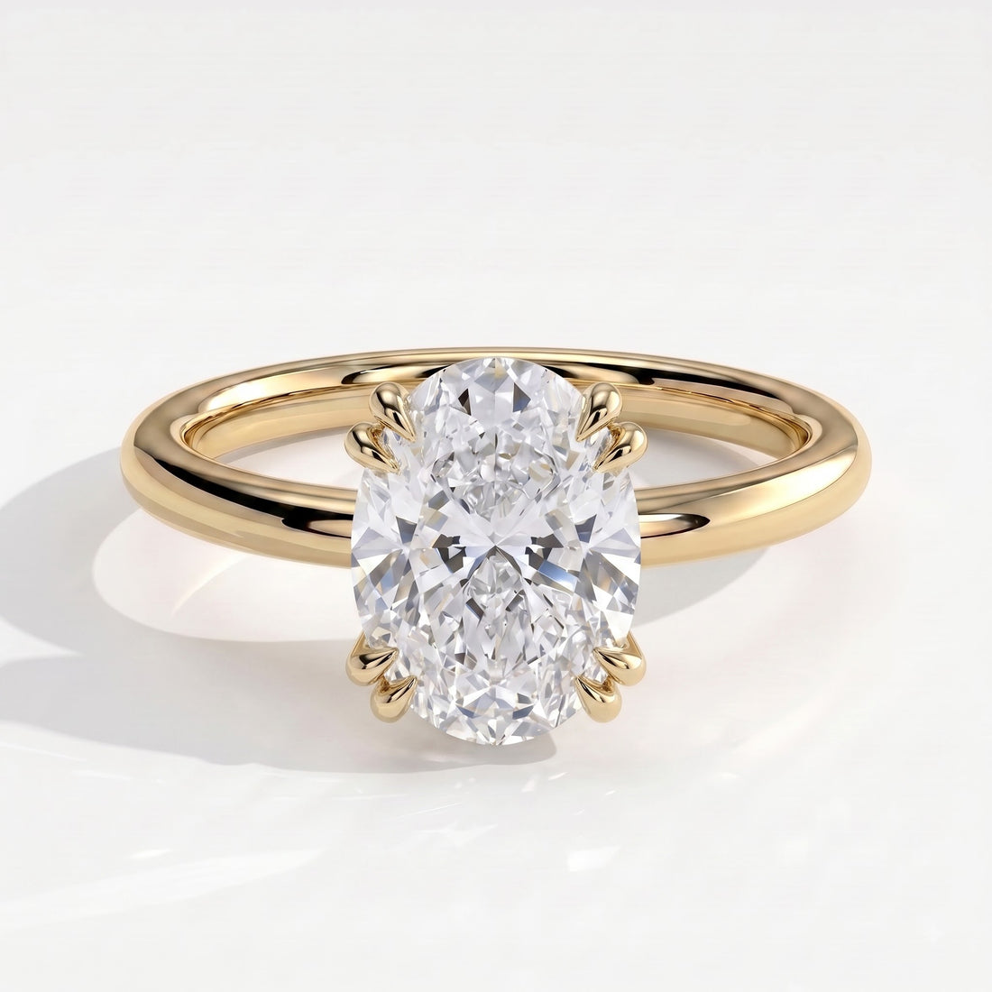Oval lab-grown diamond halo engagement ring in 14K (585) yellow gold, front view 