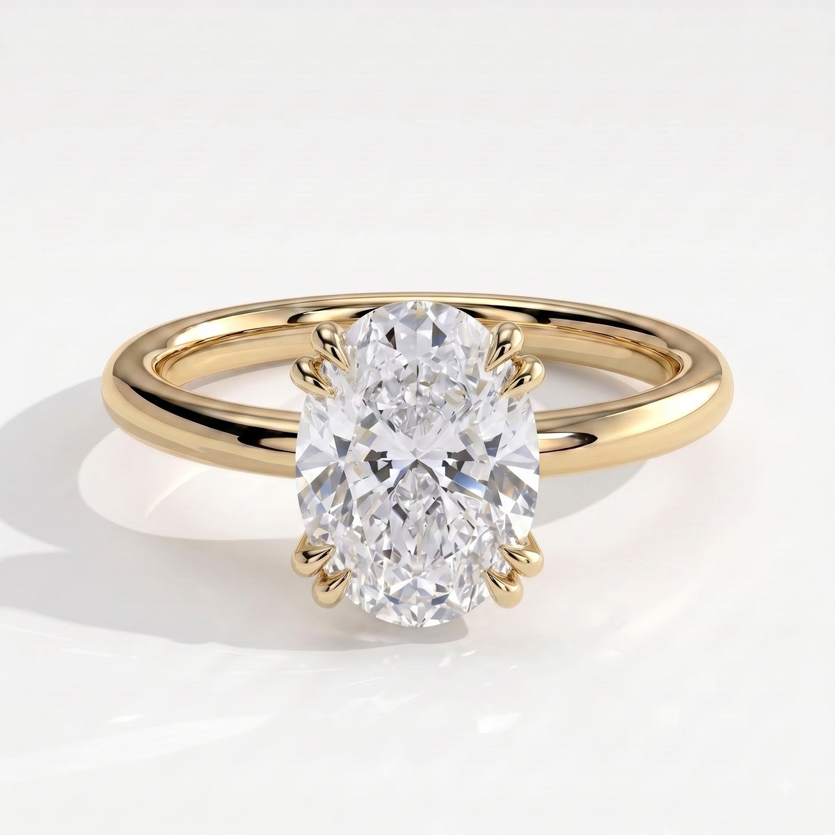 Oval lab-grown diamond halo engagement ring in 14K (585) yellow gold, front view 