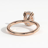 Oval lab-grown diamond halo engagement ring in 18K (750) rose gold, on white background 