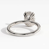 Oval lab-grown diamond halo engagement ring in 950 platinum, on white background 