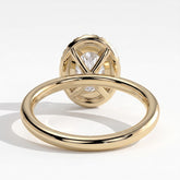 Oval lab-grown diamond halo engagement ring in 14K (585) yellow gold, on white background 