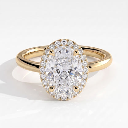 Oval lab-grown diamond halo engagement ring in 14K (585) yellow gold, front view 