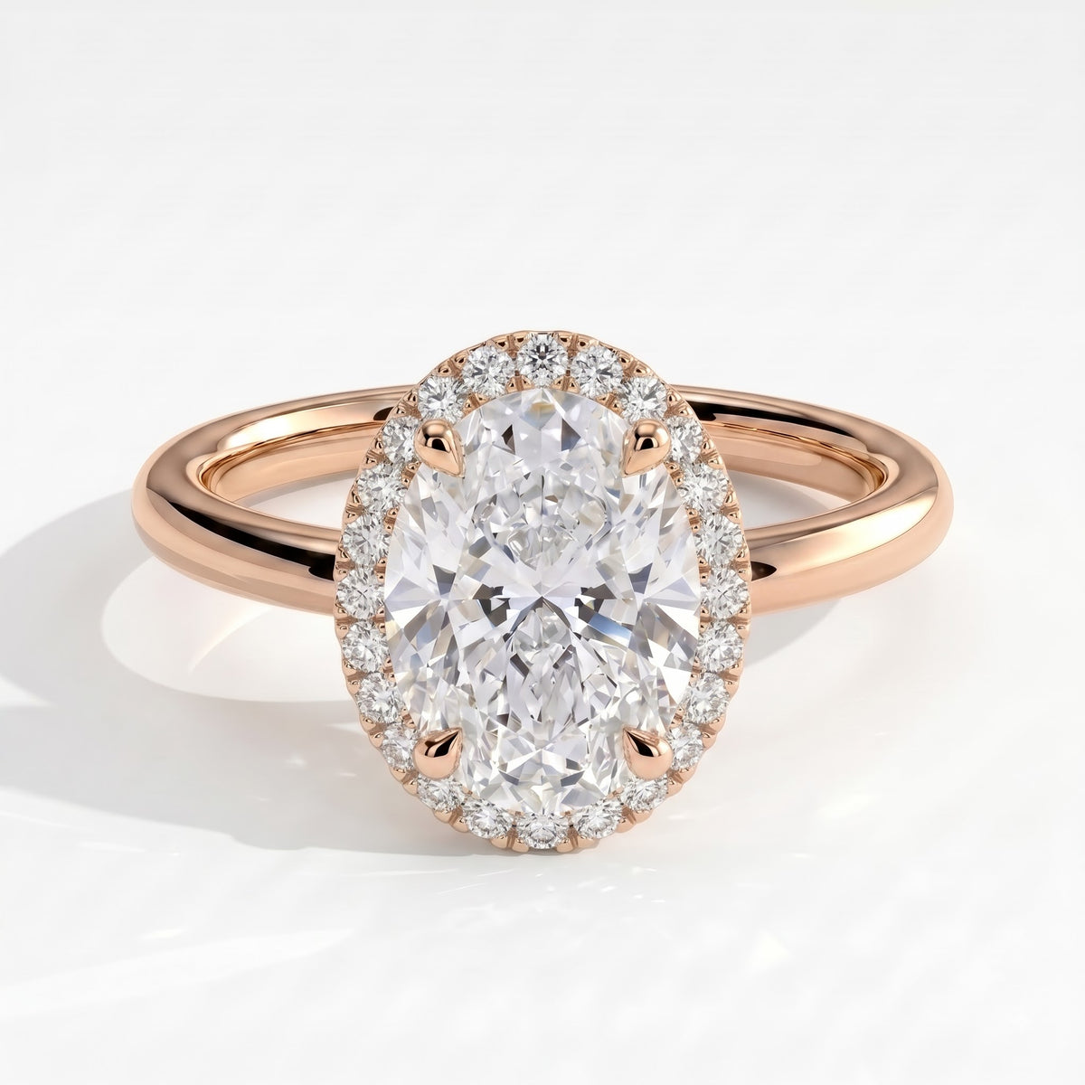 Oval lab-grown diamond halo engagement ring in 14K (585) rose gold, front view 