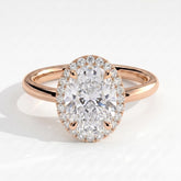 Oval lab-grown diamond halo engagement ring in 14K (585) rose gold, front view 