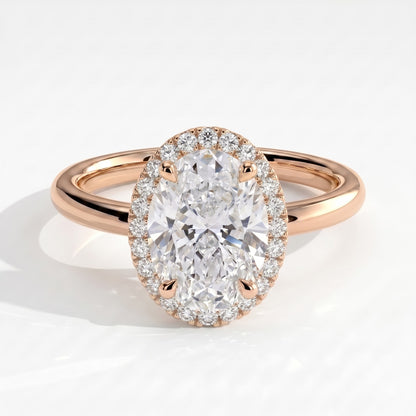 Oval lab-grown diamond halo engagement ring in 14K (585) rose gold, front view 