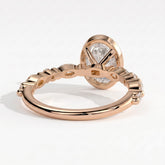 Oval lab-grown diamond bezel-set halo engagement ring in 14K (585) rose gold, on white background 